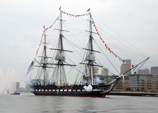 BOSTON (July 4, 2014) USS Constitution fires a 17-gun salute near U.S. Coast Guard Base Boston during the ship's Independence Day underway demonstration in Boston Harbor. Constitution got underway with more than 300 guests to celebrate America's independence. (U.S. Navy photo by Seaman Matthew R. Fairchild/Released) 